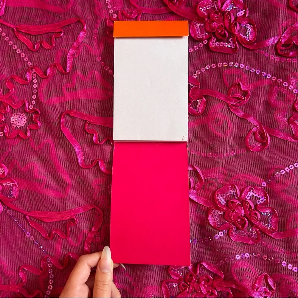 turquoise and orange unlined notepad